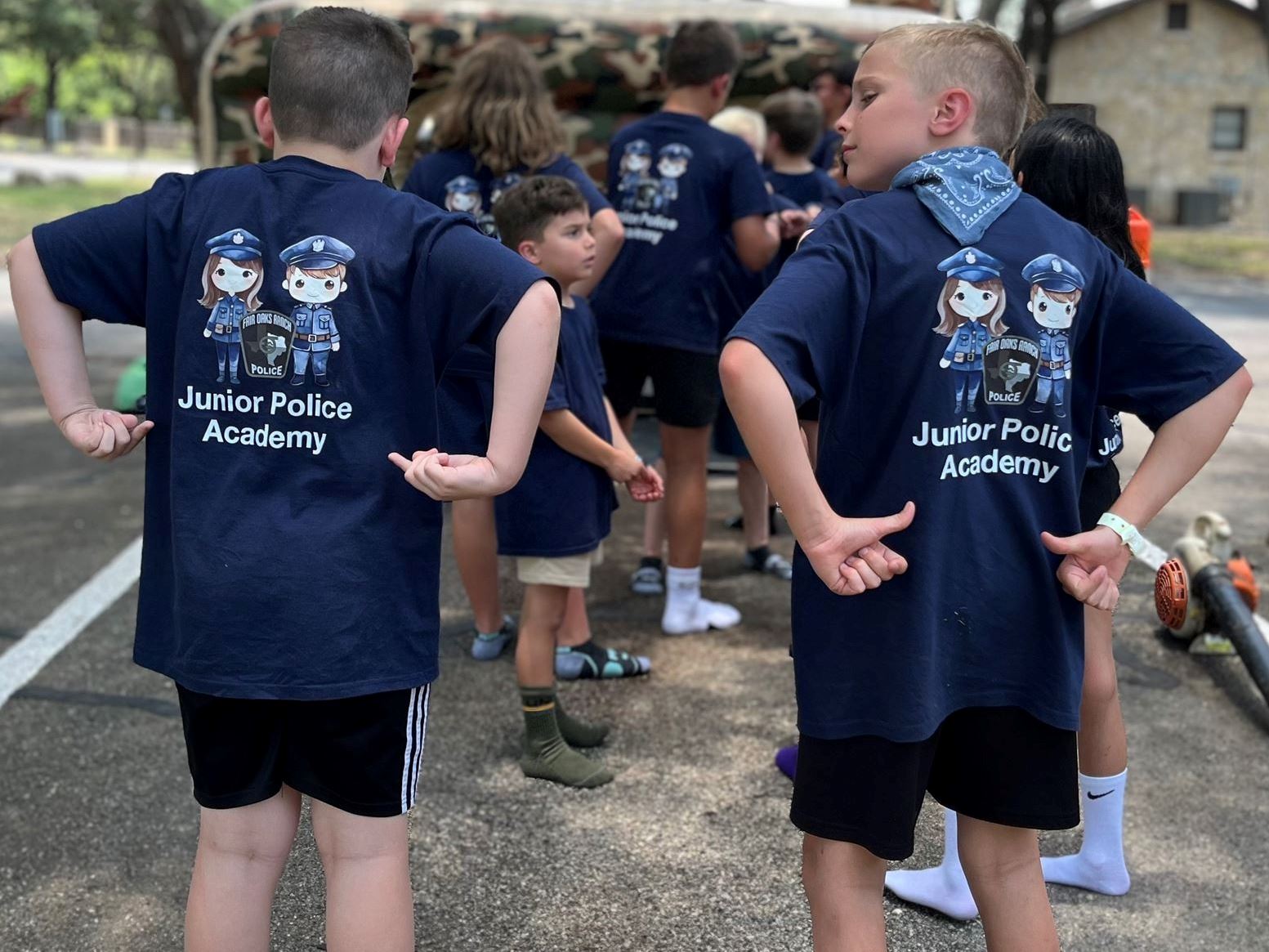 Junior Cadets Pointing at Shirt