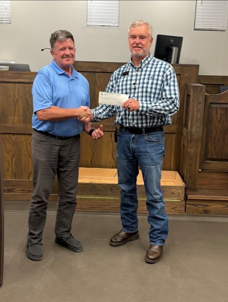 Pictured: Mayor Maxton accepting the check from FORHA Board member David Fairhurst